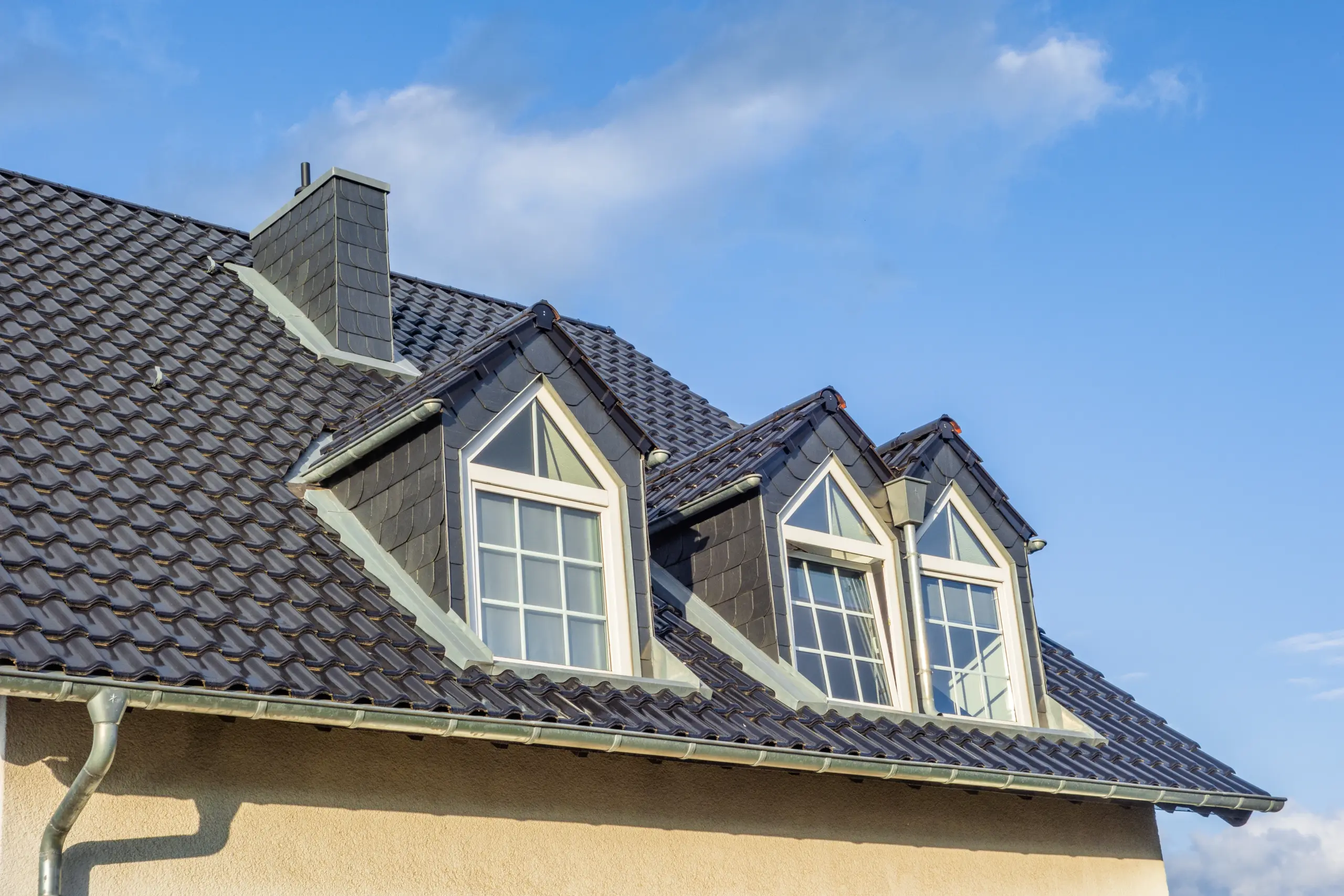 roof windows in a residential area under blue sky